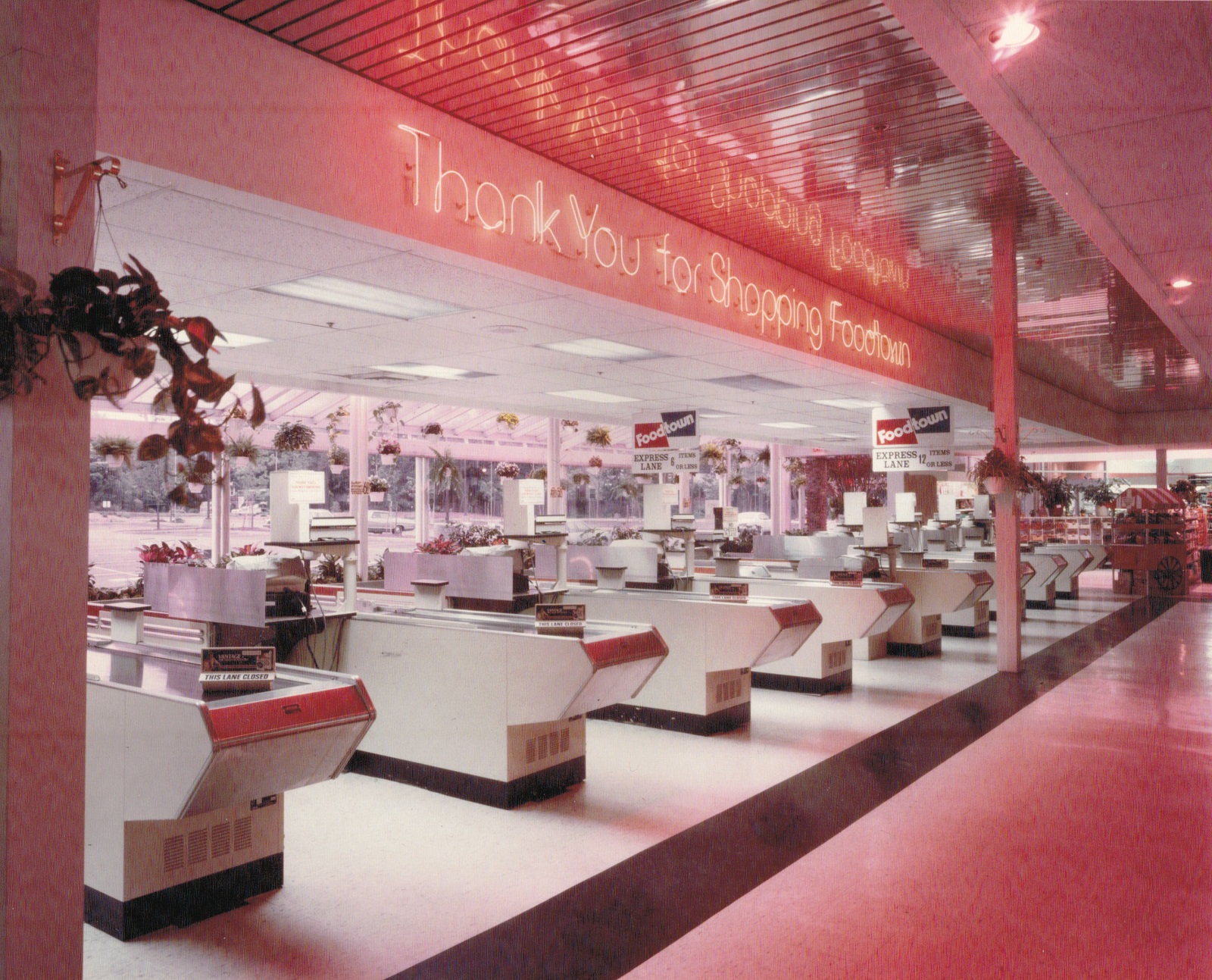 Store planning of checkout area with enclosed customer exit passageway.